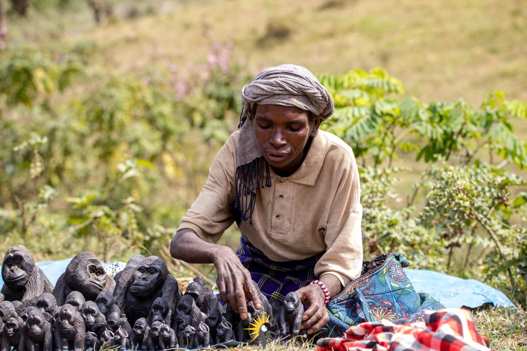A batwa woman selling crafts
