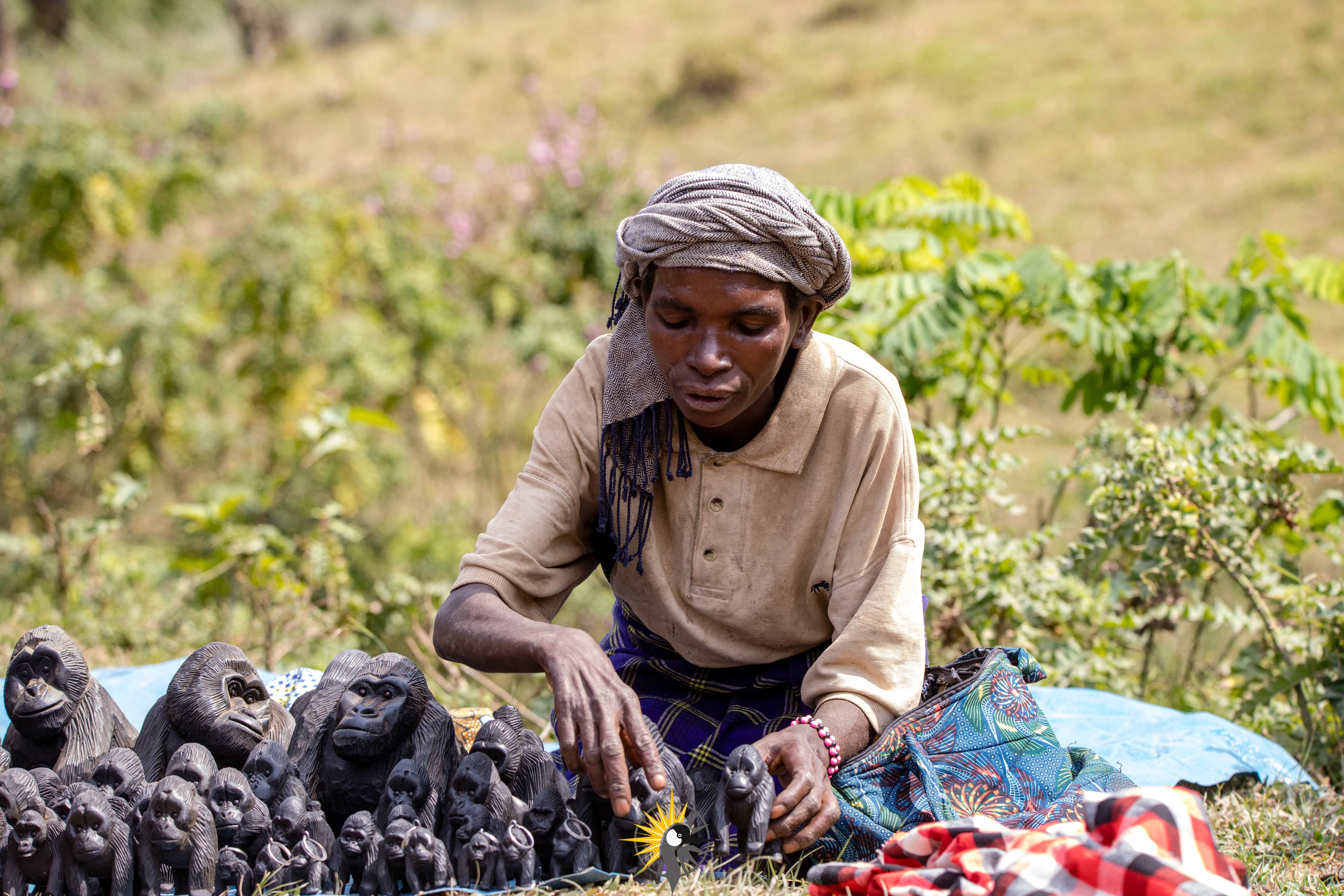 A batwa woman selling crafts