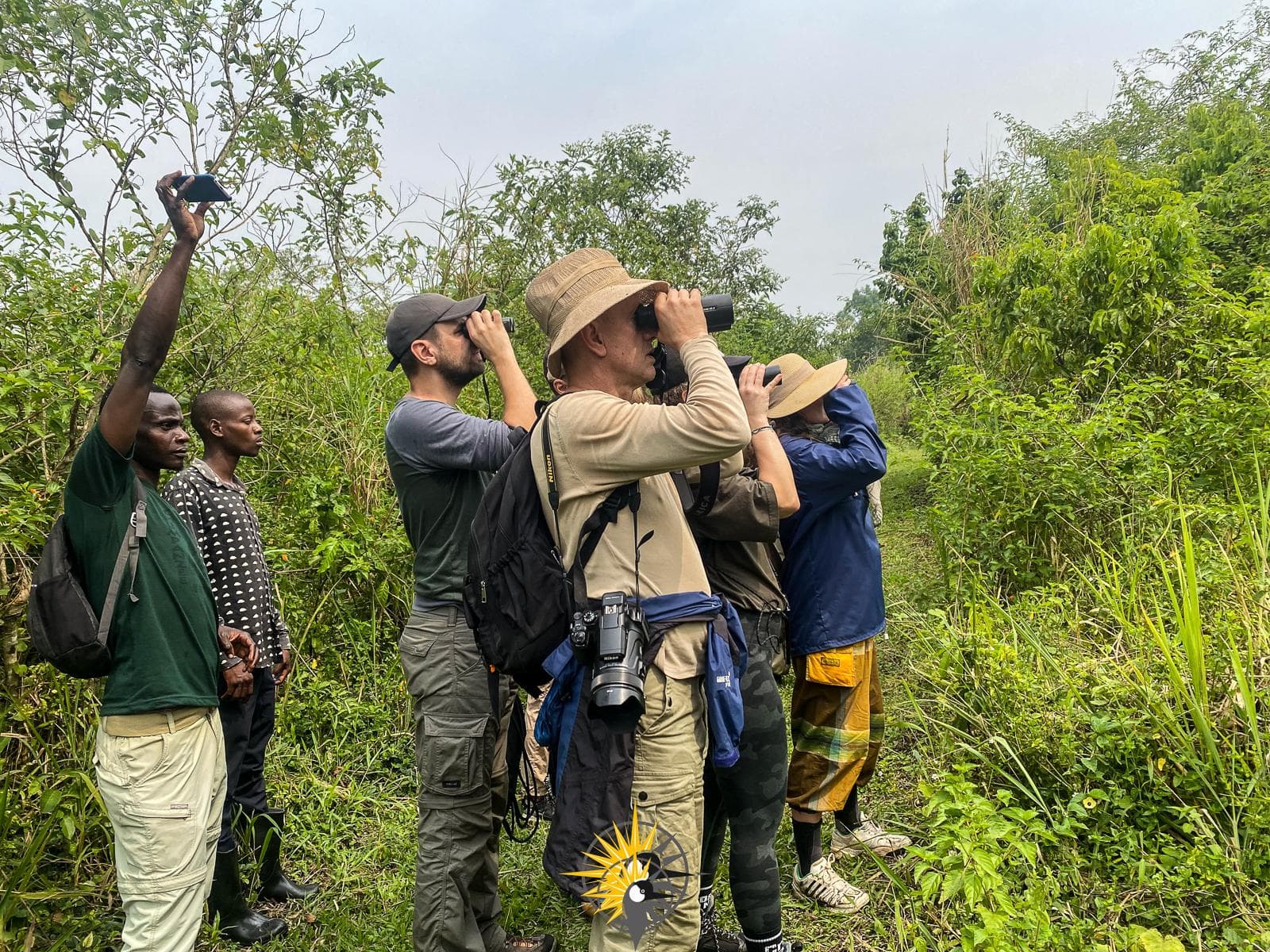 tourists doing a walk in bigodi
