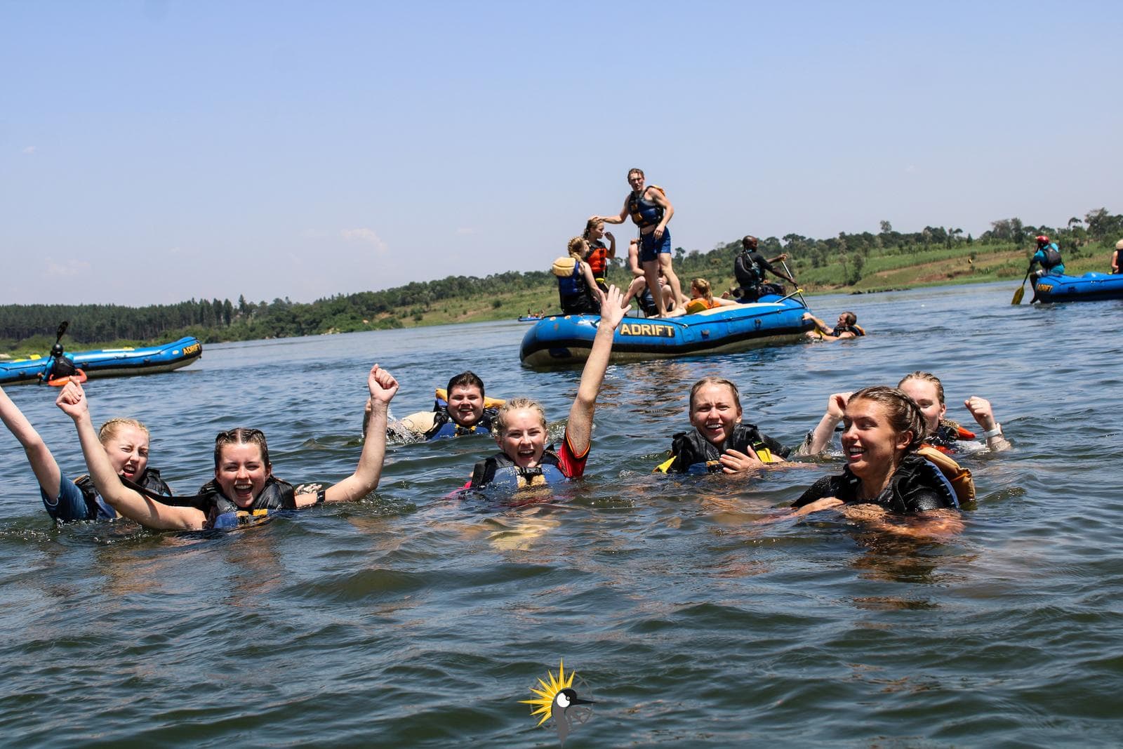 tourists doing white water rafting