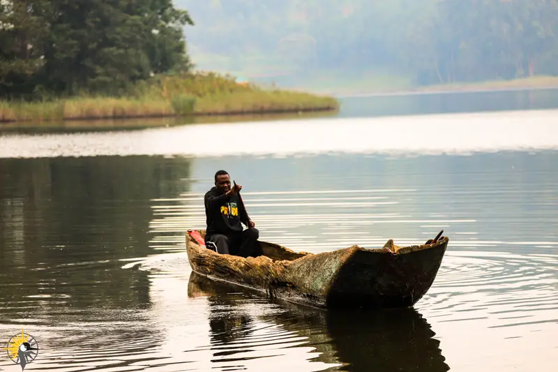 
                                
                                man on lake bunyonyi